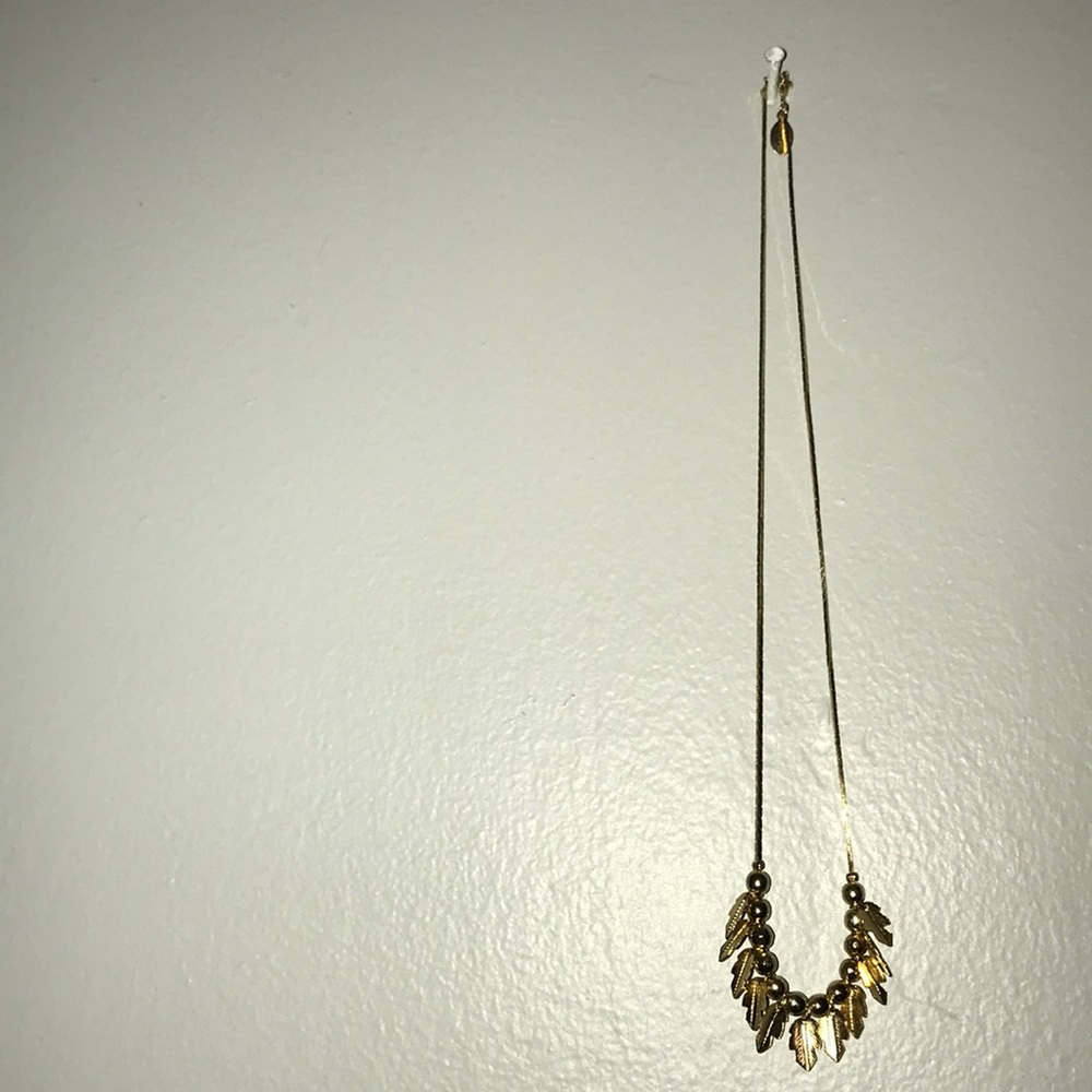 Gold feather necklace